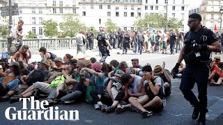 Police use pepper spray on seated climate protesters in Paris [upl. by Sayre]