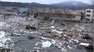 Tsunami in Kesennuma city ascending the Okawa river [upl. by Dale]