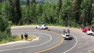 Cyclist racing downhill crashes into moving car [upl. by Weinert]