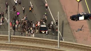 Protester falls off police car at Black Lives Matter protest [upl. by Naam804]